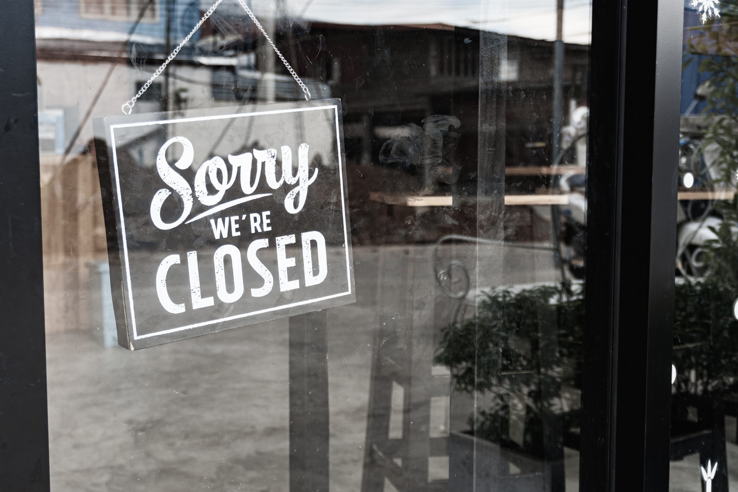 Closed sign hangs on door