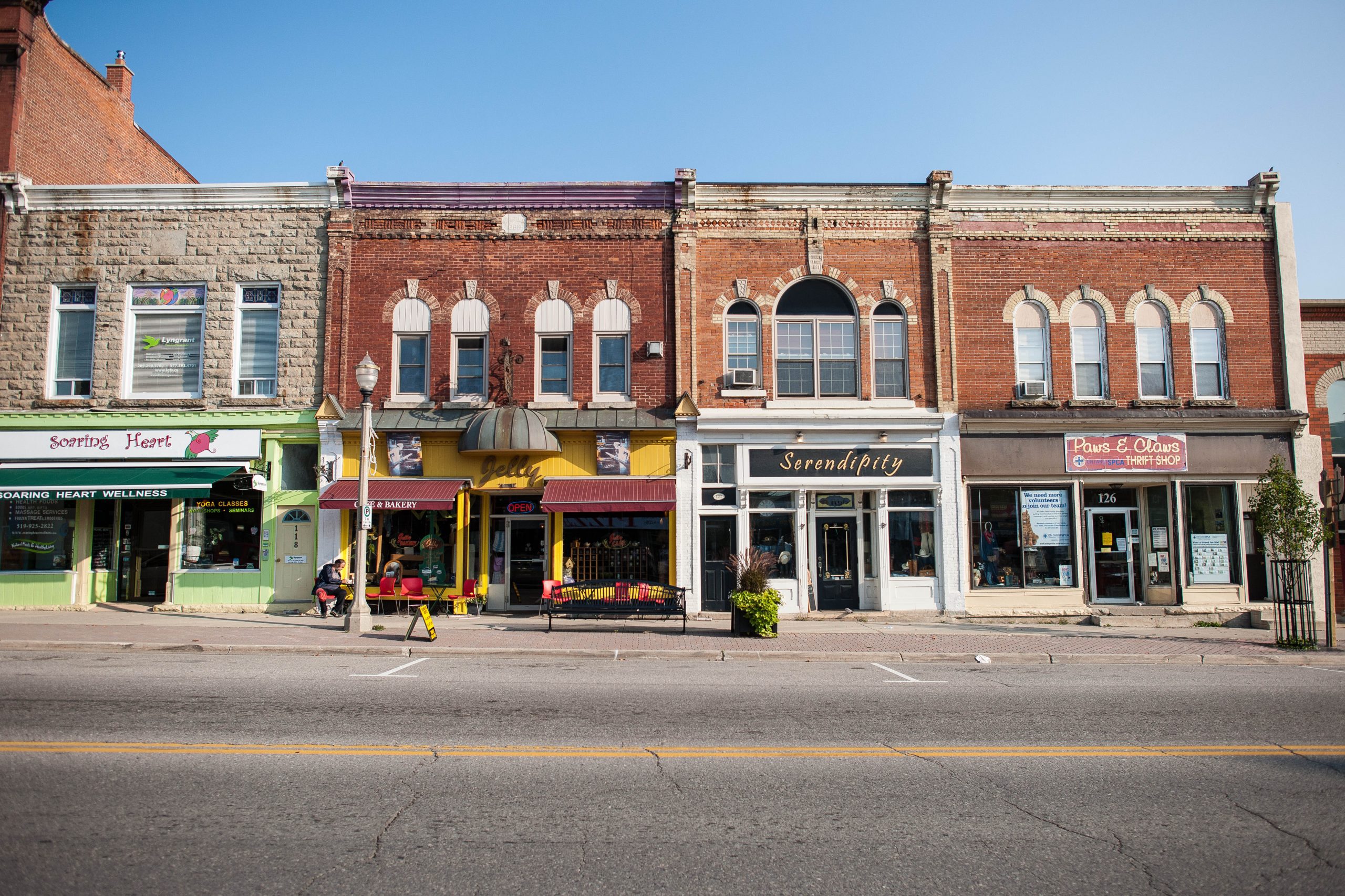 A front photo of several downtown store fronts.