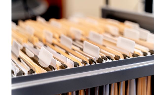 a file cabinet drawer filled with file folders